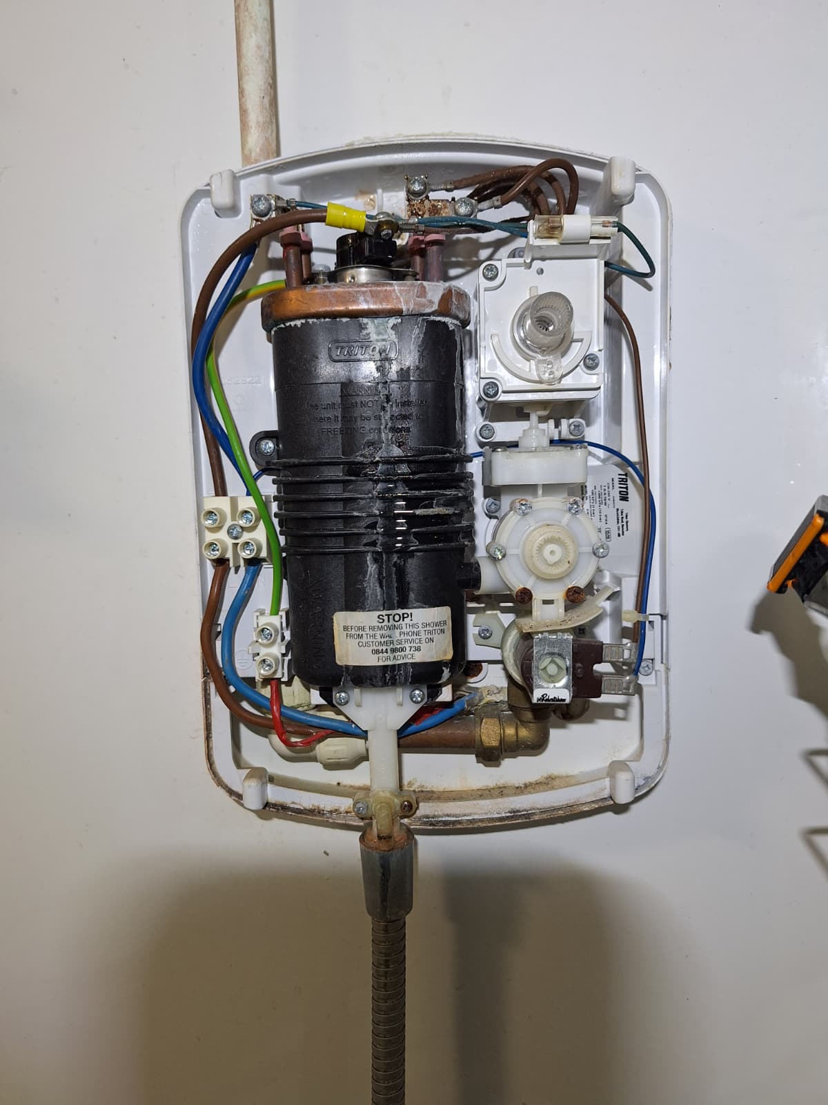 Electric shower unit being installed by JD Power Electrical Ltd